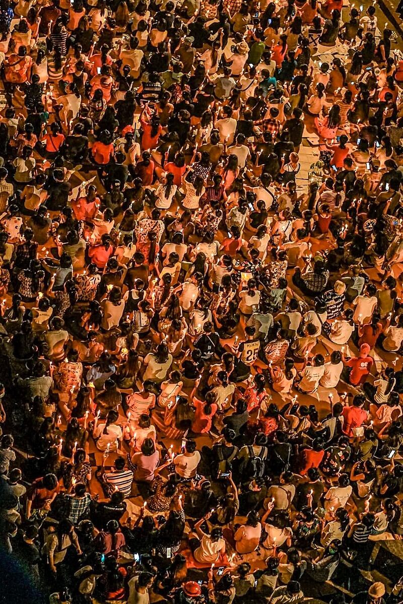 People holding prayer vigil in Yangon's Hledan in night on 03-14-2021 by CJ.jpg