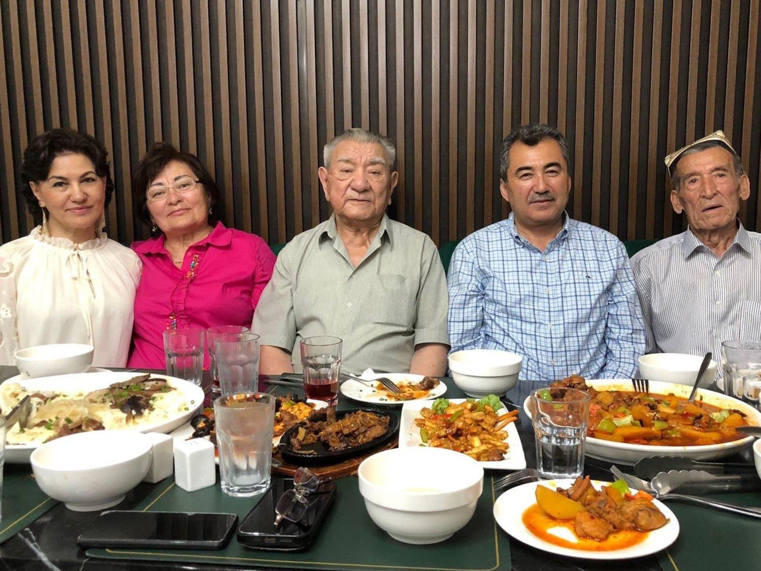 Riza Samedi (center) shares a meal with other prominent Uyghurs in Almaty, Kazakhstan, June 2024.