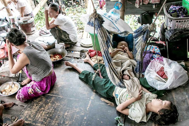 Children sleep in their home on the outskirts of Yangon. (AFP)