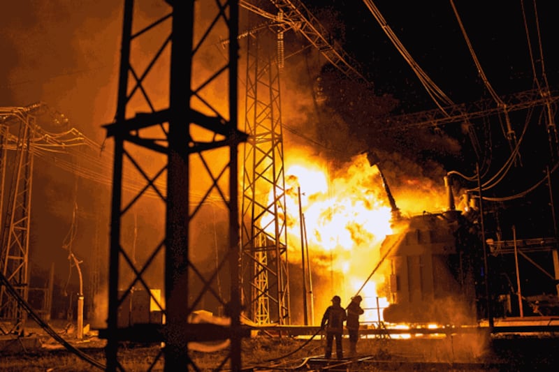 Ukrainian State Emergency Service firefighters put out a fire after a Russian rocket attack hit an electric power station in Kharkiv, Ukraine, Sept. 11, 2022. Credit: Associated Press