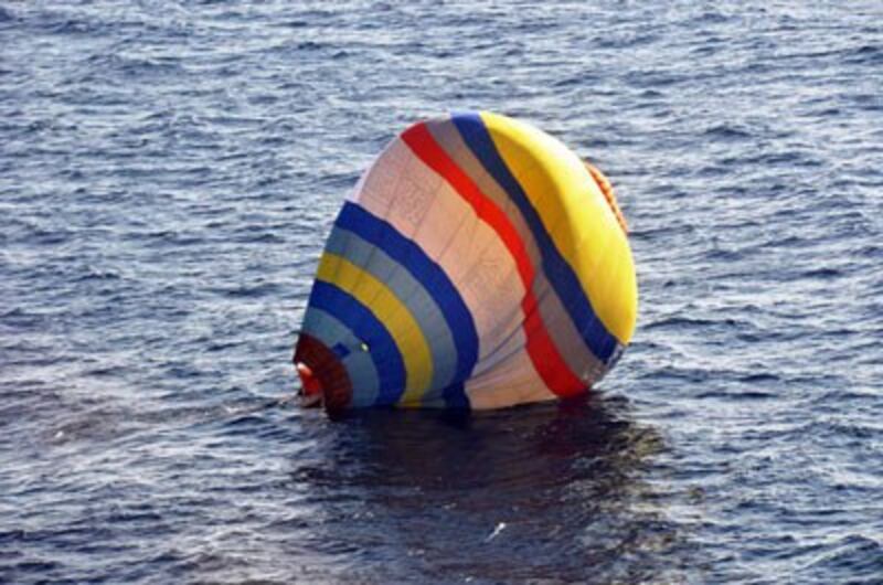 A hot air balloon carrying a Chinese man lands on the water south of the Senkaku/Diaoyu islands in the East China Sea, Jan. 1, 2014. Credit: AFP PHOTO / JAPAN COAST GUARD