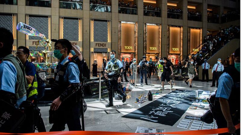 Police enter a shopping mall to disperse people attending a lunchtime rally in Hong Kong on as China passed a sweeping national security law for the city, June 30, 2020.