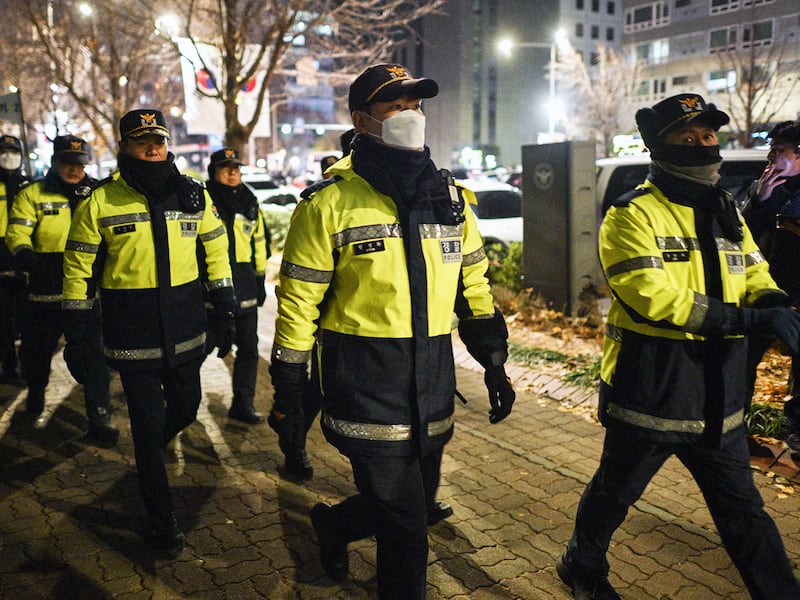 Police walk near the National Assembly in Seoul on Dec. 4, 2024, after South Korea President Yoon Suk Yeol declared emergency martial law.