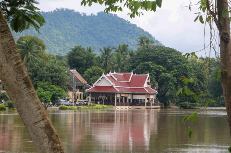 Vegetation and buildings are inundated by floodwaters in Luang Prabang province, Laos, Sept. 12, 2024. (FB/Pouth Freedomman via Reuters)