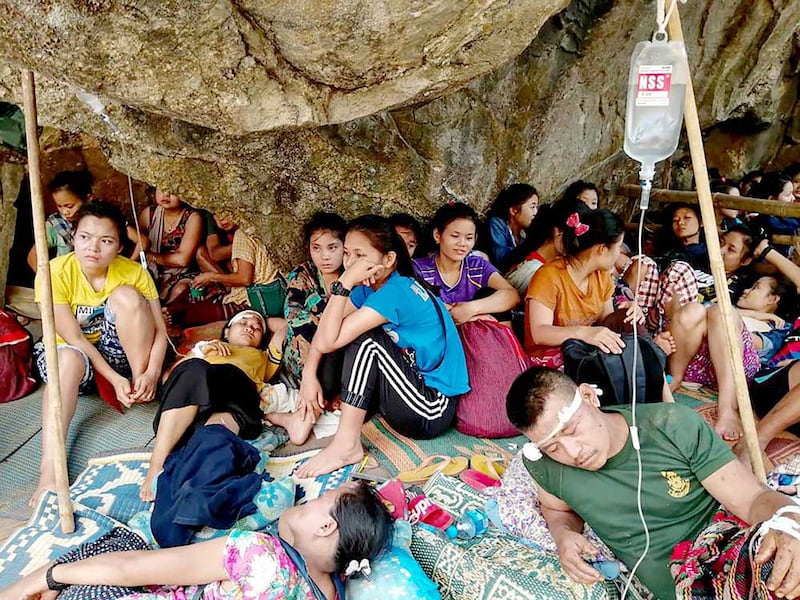 Karen villagers, injured in government air strikes in late March, take shelter and receive medical care in the jungle near the village of Day Pu No in Hpa-pun in eastern Myanmar's Karen State. (Free Burma Rangers)