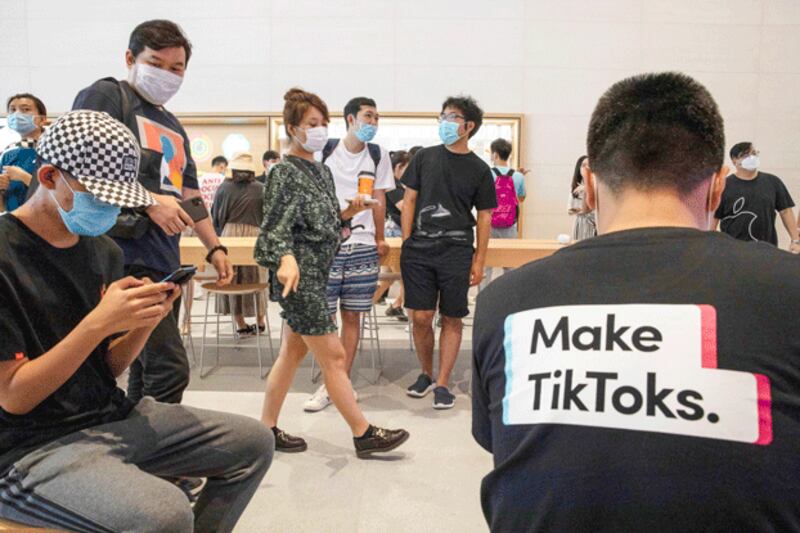 A visitor to an Apple store wears a T-shirt promoting the short-form mobile video app TikTok in Beijing, July 17, 2020. (Ng Han Guan/AP)