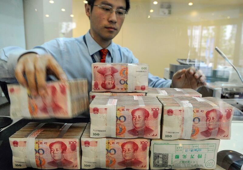 An employee counts Chinese yuan banknotes at a bank in Hefei, Anhui province, Nov. 11, 2010. (Reuters)