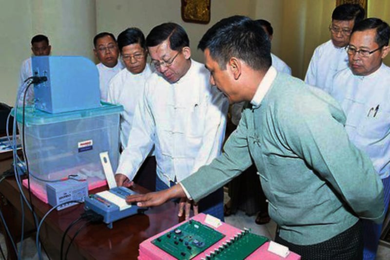 Myanmar Junta chief Senior General Min Aung Hlaing inspects the electronic voting system and its machines on Feb.9, 2023.