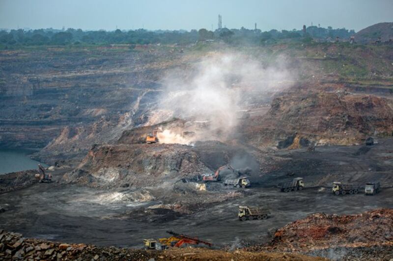 Mining is in progress at an open-cast mine near Dhanbad, an eastern Indian city in Jharkhand state, Sept. 24, 2021. Credit: Associated Press