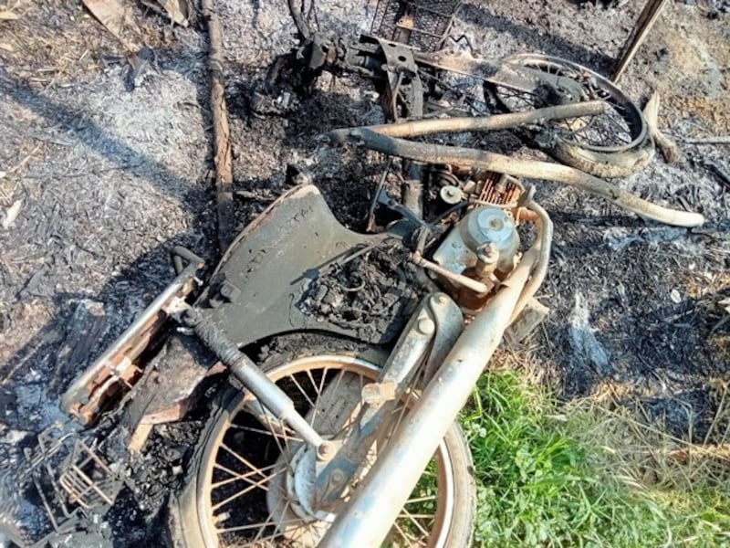 A destroyed motorbike lies on the ground in Mon Taing Pin village, Ye-U township, in northwestern Myanmar's Sagaing region, following the torching of homes there by junta forces , May 31, 2023. Credit: Citizen journalist