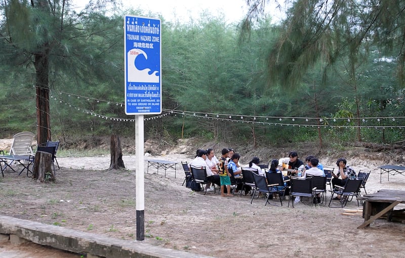 A sign warns of tsunami dangers in Ban Nam Khem district in Phang Nga province, Thailand, Dec 6, 2024.