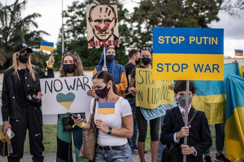 Nearly three dozen people, a majority of them Ukrainian, protest Russia's invasion of their country outside the Russian Embassy in Kuala Lumpur, Feb.28, 2022. Credit: BenarNews