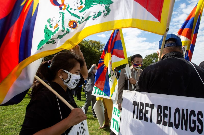 Tibetan protesters participate in "Resist CCP: Global Day of Action" in front of the Capitol Reflecting Pool in Washington D.C., Oct. 1, 2020. 