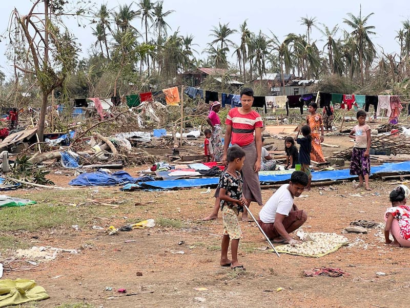 Residents of Bay Dar salvage what they can of their belongings three days after the cyclone made landfall. (Photo: RFA)