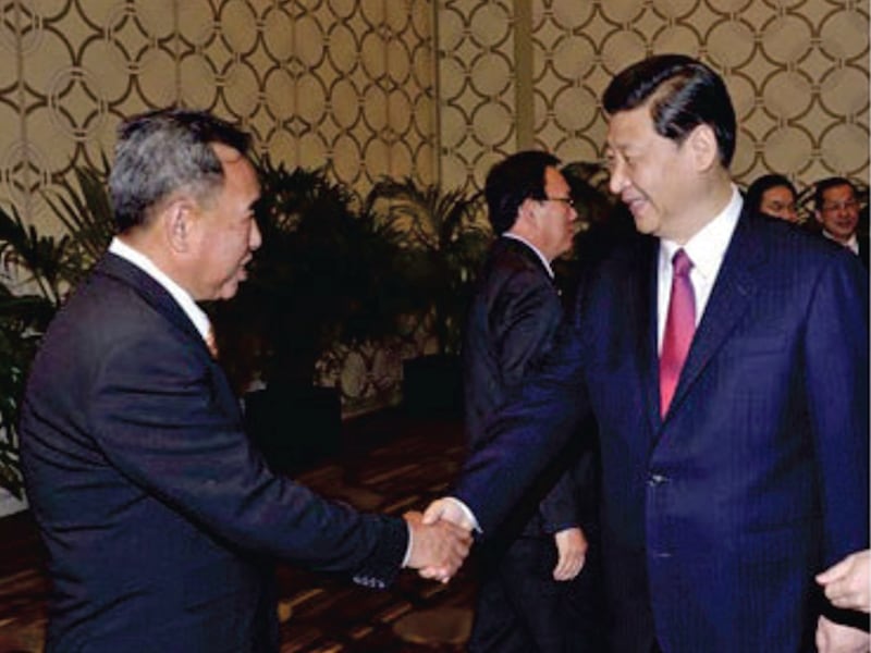 Mike Sun, left, meets Chinese President Xi Jinping at a CCP 70th Anniversary event, Beijing, China, 2019.