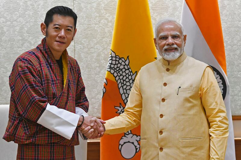 Bhutan's King Jigme Khesar Namgyel Wangchuck, left, and India's Prime Minister Narendra Modi prior to their meeting in New Delhi September 14, 2022. (Indian Press Information Bureau (PIB)/AFP)