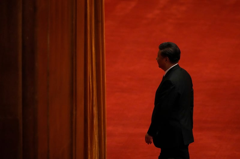 Chinese President Xi Jinping leaves after delivering a speech at an event commemorating the 110th anniversary of Xinhai Revolution at the Great Hall of the People in Beijing, Oct. 9, 2021. Credit: AP Photo