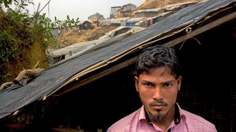 Rohingya Muslim refugee Mohammad Lalmia from the Myanmar village of Gu Dar Pyin in Rakhine state poses for a portrait at the Balukhali refugee camp in southeastern Bangladesh, Jan. 14, 2018.