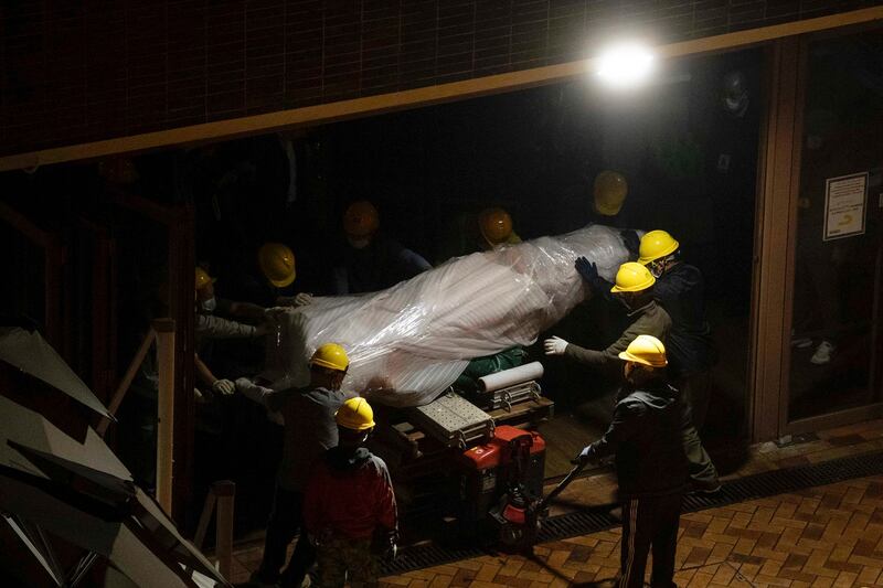 The "Pillar of Shame" statue is removed from the University of Hong Kong, Dec. 23, 2021. Credit: Lam Chun Tung/The Initium Media via AP