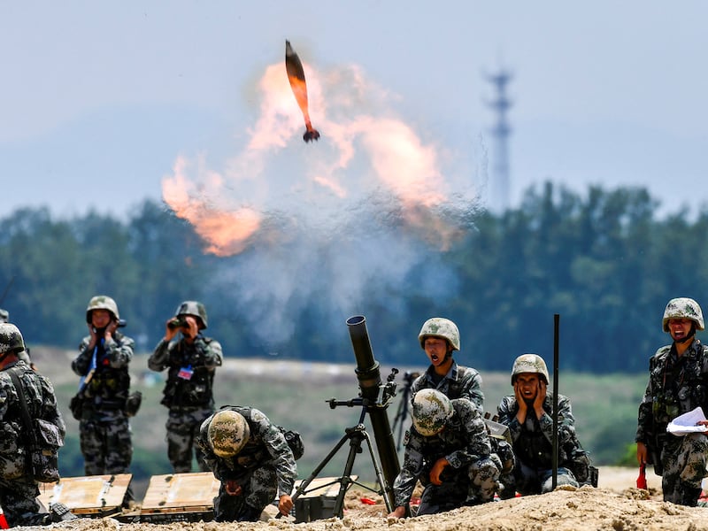 Soldiers of Chinese People's Liberation Army fire a mortar during a live-fire military exercise in Anhui province, China May 22, 2021. (Reuters)