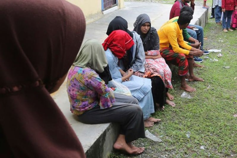 Rohingya refugees rescued from their capsized boat rest at a local government building in Samatiga, Aceh province, Indonesia, March 20, 2024. (AP)