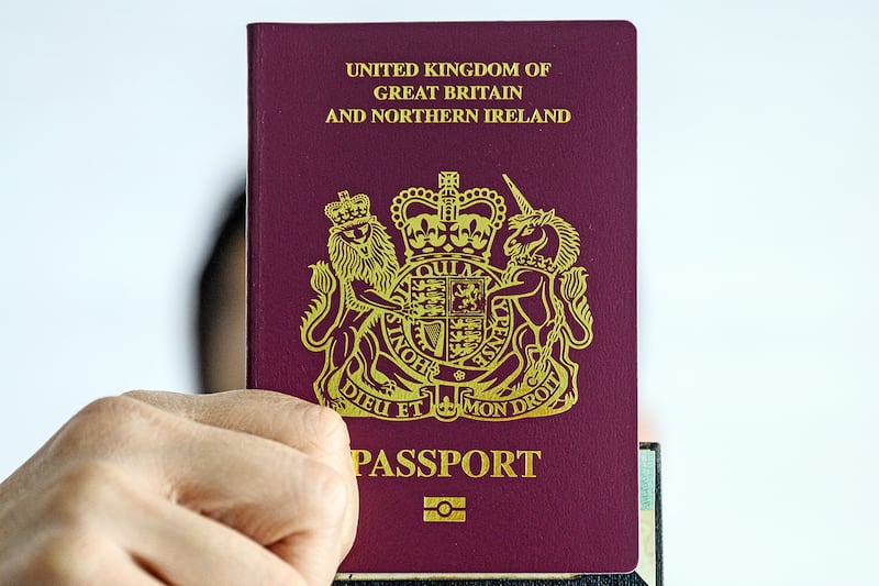 A person holds up a British National overseas passport in Hong Kong,  Jan. 29, 2021.