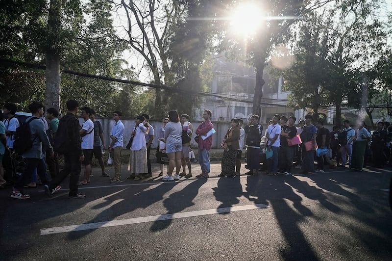 More than 1,000 people lined up to get visas at the embassy of Thailand in Yangon on Feb. 16, 2024. (AFP)