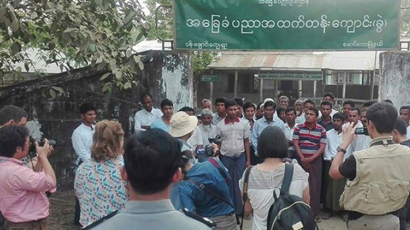 A group of foreign journalists interviewing Muslim Rohingya residents during a government controlled trip in Maungdaw, near the Myanmar-Bangladesh border, in photo released by Myanmar News Agency on April 3, 2018.