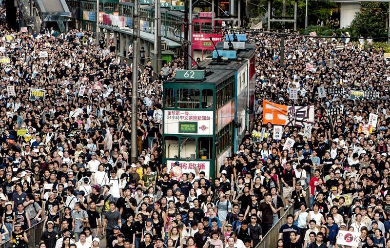 People march to Hong Kong government headquarters to protest plans to enact the anti-subversion bill. (Associated Press)