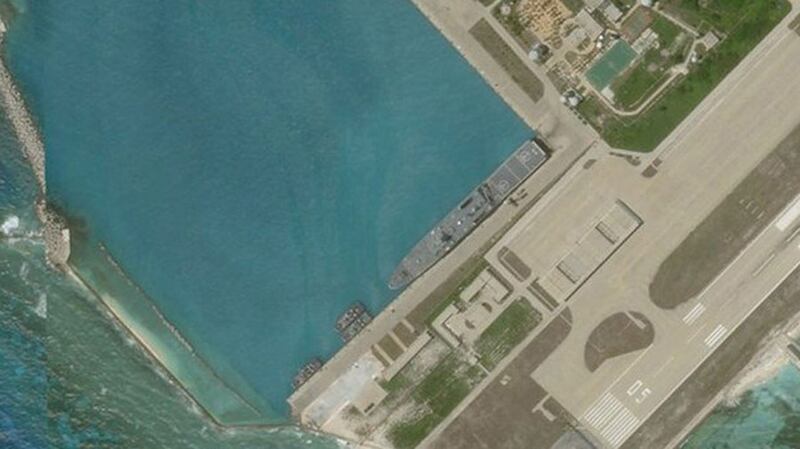 Satellite imagery shows what appears to be an amphibious assault transport ship of the Chinese Navy docked at Woody Island in the South China Sea, June 27, 2020. 