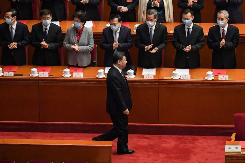 China's President Xi Jinping (front) appears for the closing session of the National People's Congress (NPC) at the Great Hall of the People in Beijing, March 11, 2022. Credit: AFP