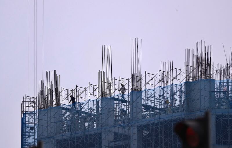 Workers at a construction site in Hanoi, Vietnam in 2023. (Hau Dinh/AP)