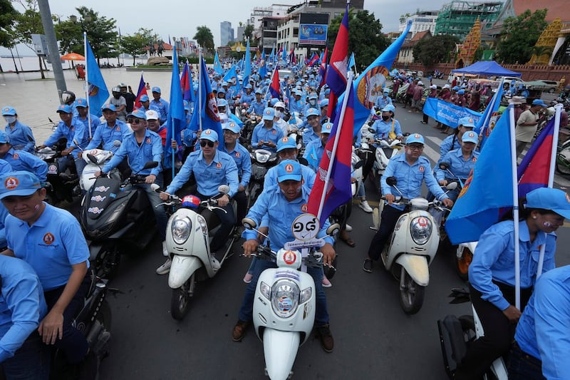 Cambodian People's Party supporters rally in Phnom Penh, July 21, 2023. The ruling party, it had warned that the country would descend back into the barbarism and anarchy of the Khmer Rouge days if it was not in power. Credit: Heng Sinith/AP