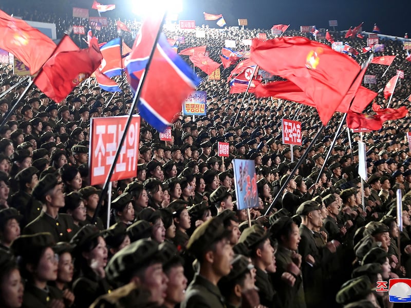 Young people, including students and youth league officials, participate in an army enlistment event in North Korea, in this undated photo.