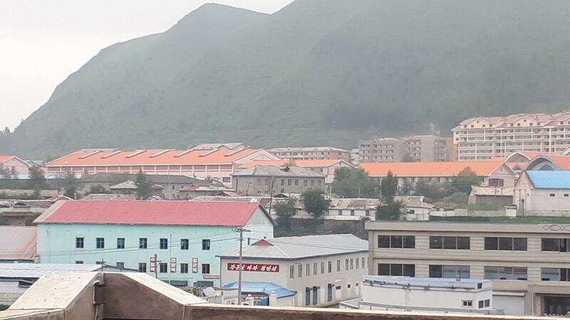 Complete view of a North Korea-China joint lumber export operation in Hyesan, North Korea, visible from across the border in China.