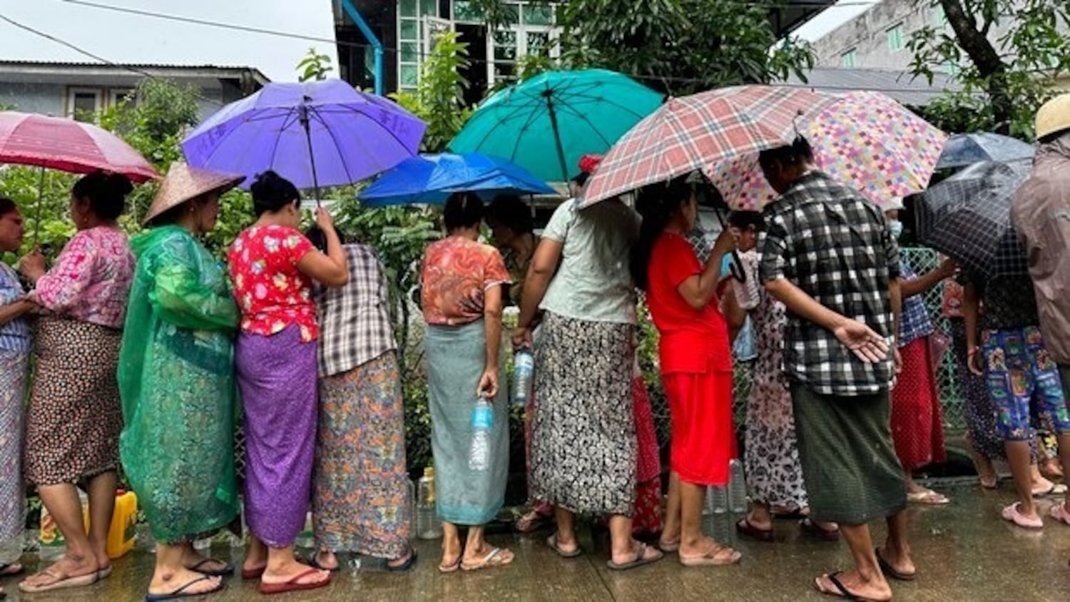 People line up to buy cooking oil at junta-set prices on Sept. 15, 2023, in Thingangyun township, Yangon.