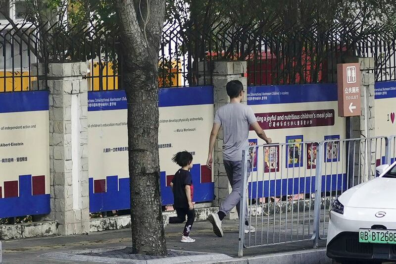 The fence to the Shenzhen Japanese School, scene of the killing of a 10-year-old Japanese boy on Sept. 18, 2024, is seen on Sept. 19, 2019.