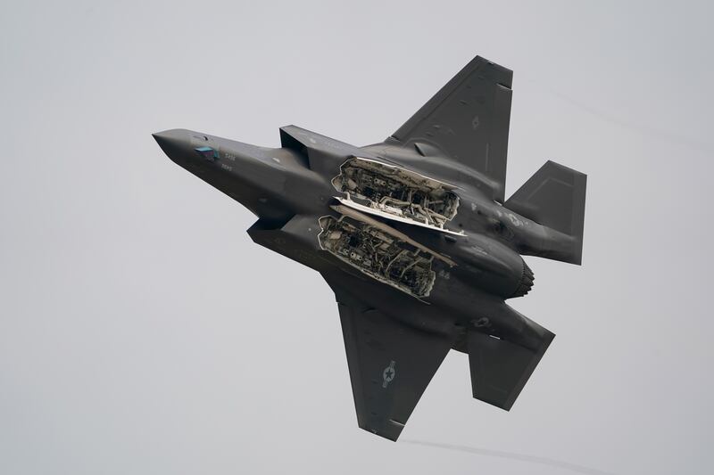 A U.S. Air Force F-35A demonstration team fifth generation jet opens its weapons bay as it performs over Don Mueang air base in Bangkok, March 7, 2025.