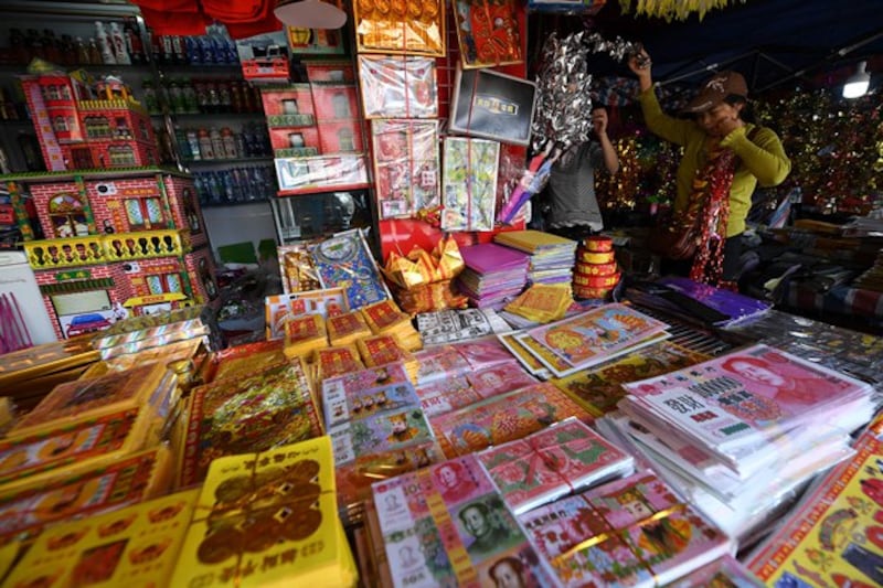 Banknotes and other paper replicas burned by people for Qingming are seen at a shop in Nanning, capital of southern China's Guangxi Zhuang Autonomous Region, April 1, 2017. (Reuters)