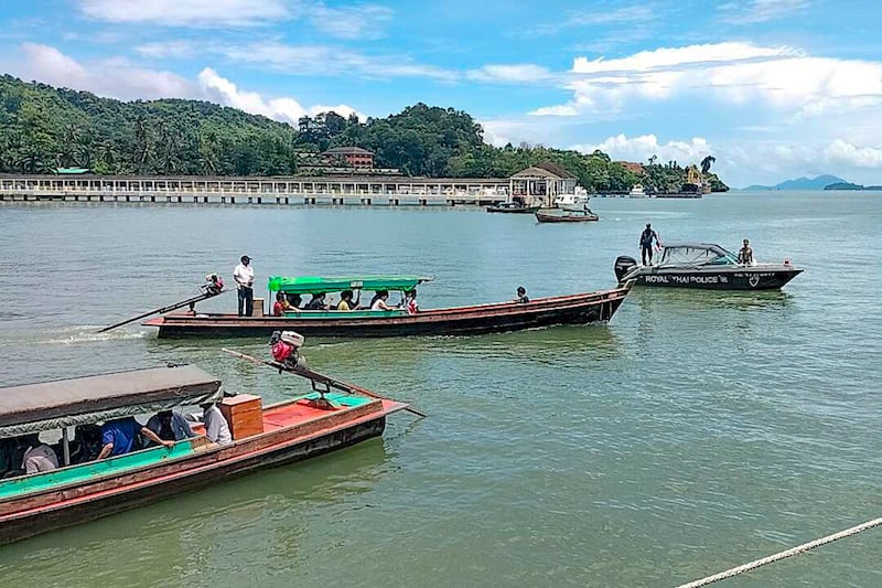 Myanmar citizens who will be repatriated to Kawthoung, Myanmar, are gathered at the port for deportation in Ranong, Thailand, Aug. 7, 2024. (Ranong Immigration Office via Facebook)