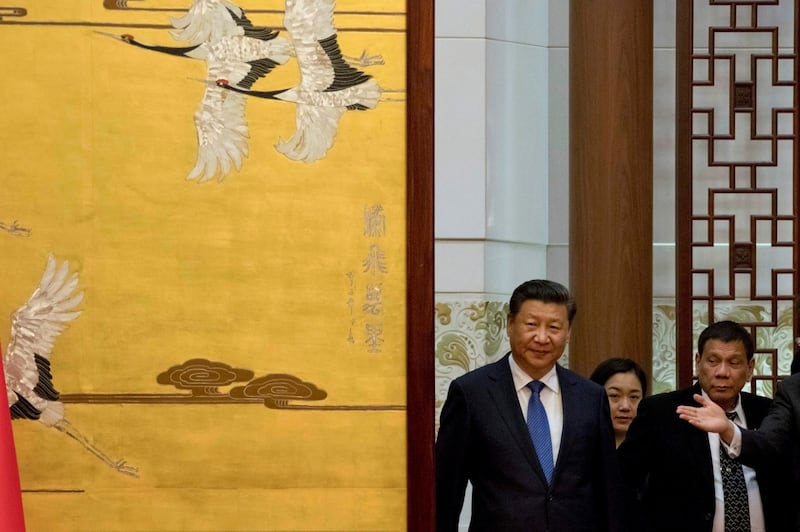 Chinese President Xi Jinping and Philippine President Rodrigo Duterte (right) arrive for a signing ceremony in Beijing, Oct. 20, 2016. (Reuters/Ng Han Guan/Pool)