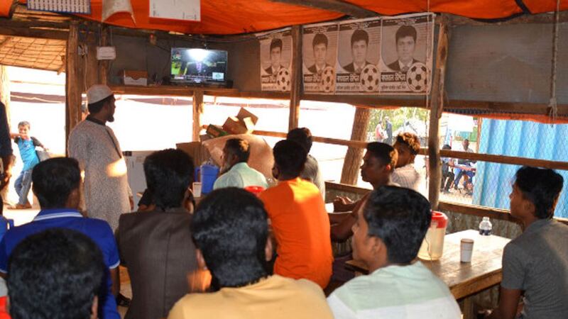 Rohingya gather in a tea stall in Ukhia, Cox's Bazar, to watch the ICJ hearing, Dec. 10, 2019.