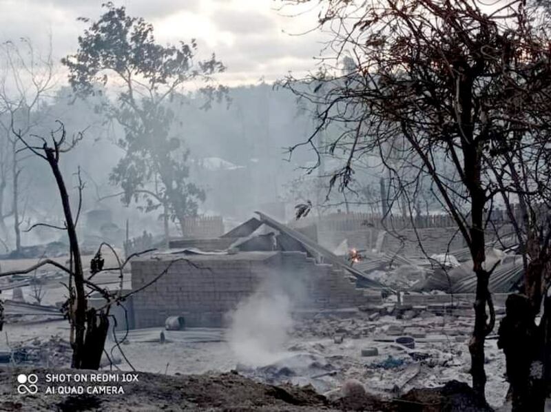 Smoke rises from remains of houses burned down in Kin Ma village, in central Myanmar's Magway region, June 16, 2021, Credit: Citizen Journalist