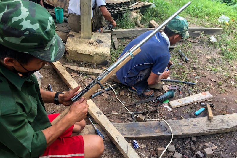 Members of the People's Defense Force (PDF) militia make handmade guns to be used in fighting against security forces in Kayah state, June 4, 2021. AFP