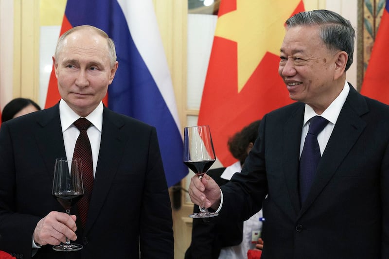 Russian President Vladimir Putin, left, and Vietnamese President To Lam toast during a reception after their talks in Hanoi, June 20, 2024. (Gavriil Grigorov/Sputnik, Kremlin Pool via AP)