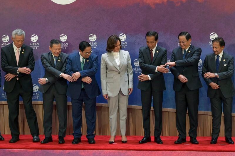 U.S. Vice President Kamala Harris watches as leaders of ASEAN prepare to pose for a group photo during the ASEAN-U.S. Summit in Jakarta, Indonesia, Sept. 6, 2023. (Bay Ismoyo/Pool via AP)