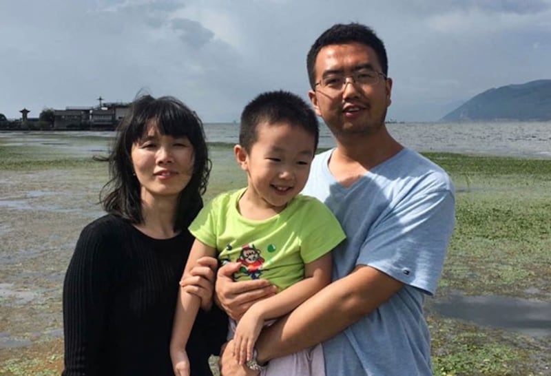 Chen Zijuan (L) and Chang Weiping (R) pose together with their son in an undated photo taken before Chang's imprisonment. (Chen Zijuan)