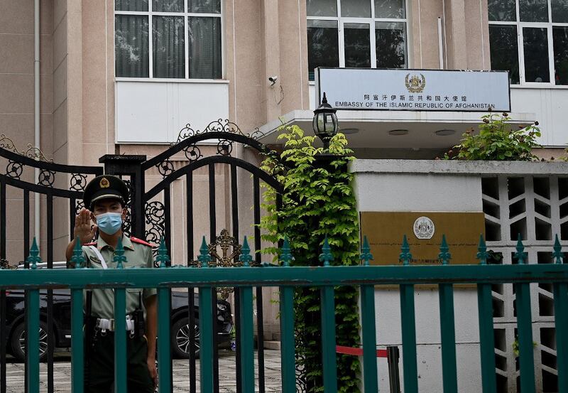 A Chinese paramilitary police stands guard outside the Afghanistan embassy in Beijing, Aug. 16, 2021. Credit: AFP