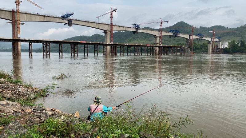 This file photo from 2019 shows the same bridge, a key landmark on the 257 mile (414 kilometer) Lao-China Railway that will run from the Chinese border to near the capital Vientiane at the border with Thailand when complete in 2021.