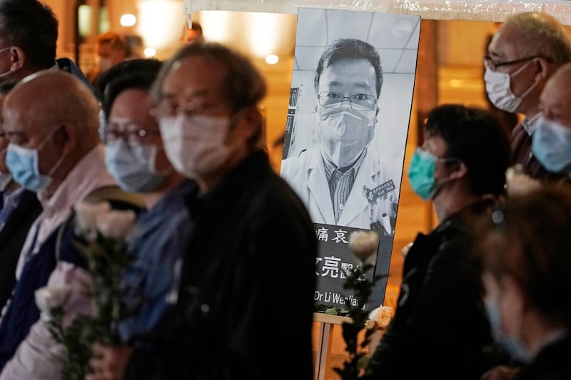 People attend a vigil for Wuhan doctor and COVID-19 whistleblower Li Wenliang, in Hong Kong, Feb. 7, 2020. Credit: Associated Press